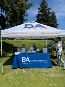 B&A Litigation Services tent and table setup at the TPCBA golf tournament in Tacoma