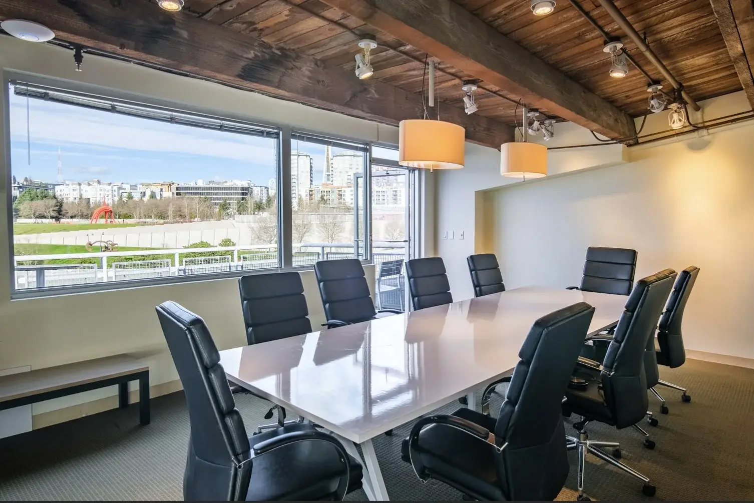 Seattle boardroom at B&A Litigation Services, with a conference table for 10 and windows over the Olympic Sculpture Park
